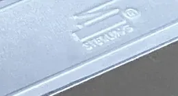 Sterling DC 1800 LA surface-mounted door closer in silver finish, close-up of the housing with the embossed Sterling mark