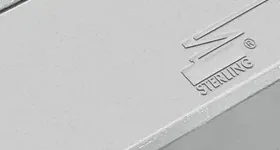 Sterling DC 2000 surface-mounted door closer in silver finish, close-up of the housing with the embossed Sterling mark