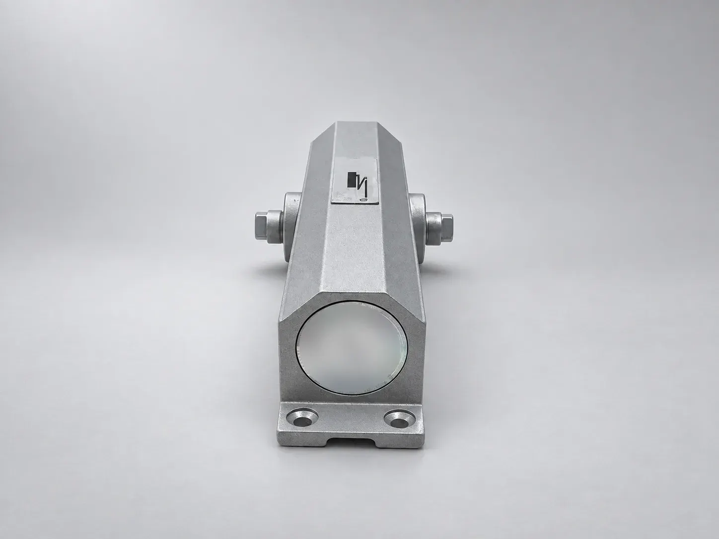 Sterling DC 1500 door closer body, end view showing the end cap, the spindle and the fixing feet, studio photograph