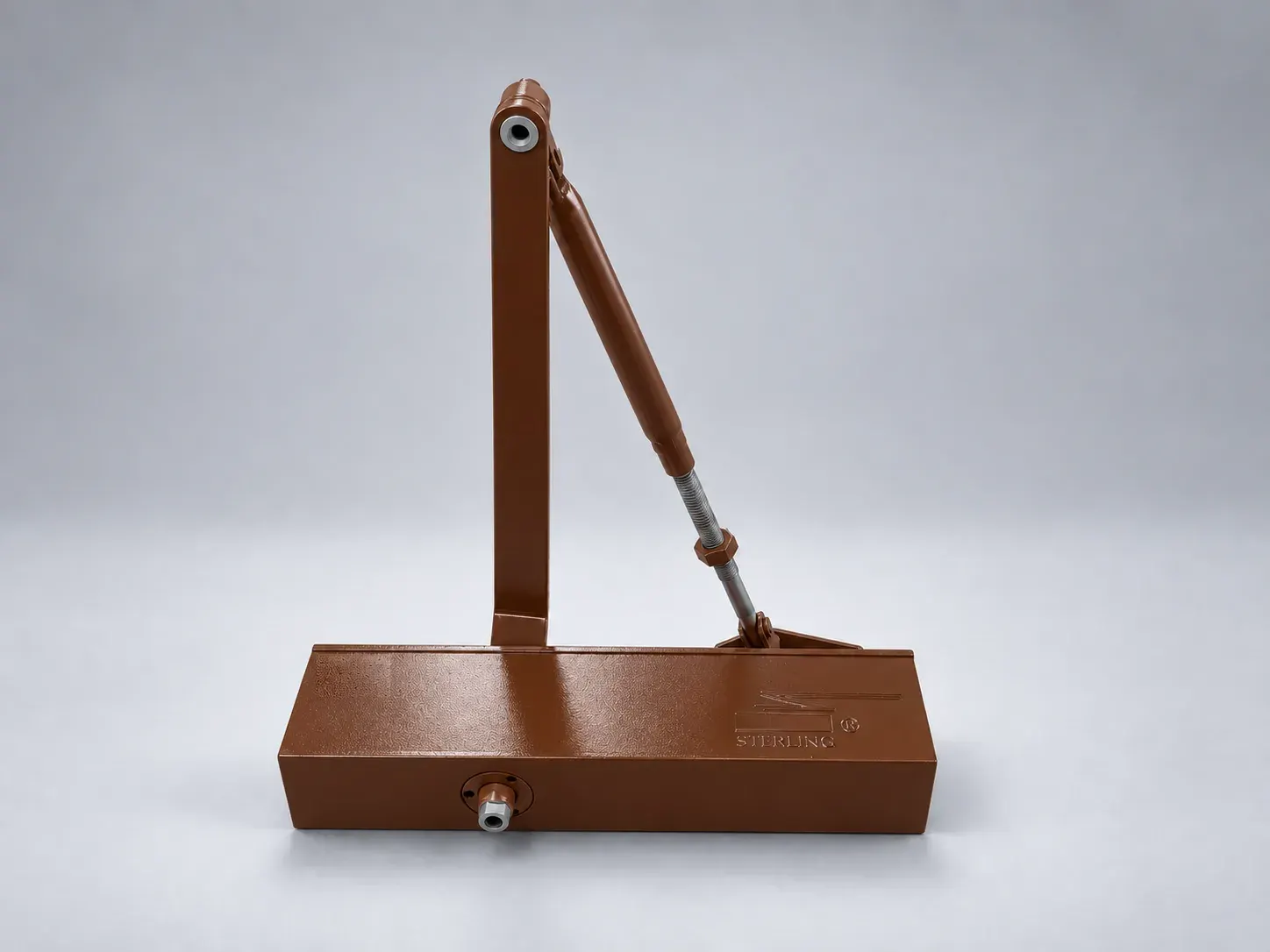 Sterling DC 2000 door closer with its lever arm raised, front view, digitally recoloured studio photograph showing the brown finish