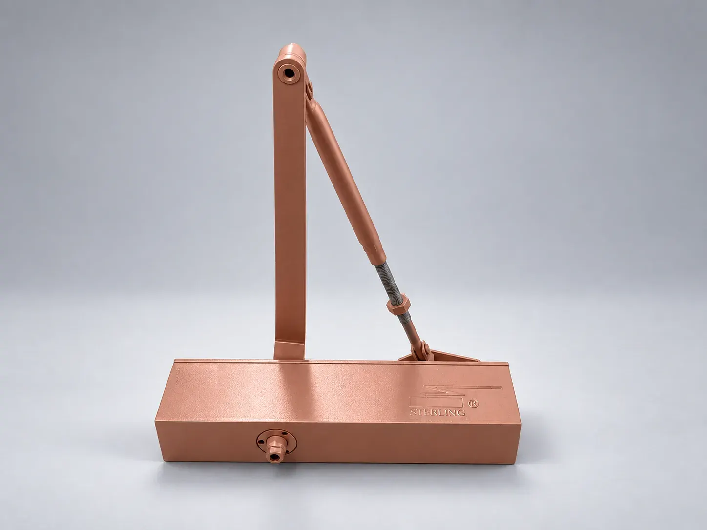 Sterling DC 2000 door closer with its lever arm raised, front view, digitally recoloured studio photograph showing the rose gold finish
