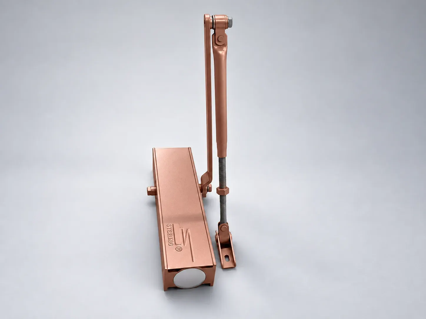 Sterling DC 2000 door closer with its lever arm raised, three quarter view from the end cap, digitally recoloured studio photograph showing the rose gold finish