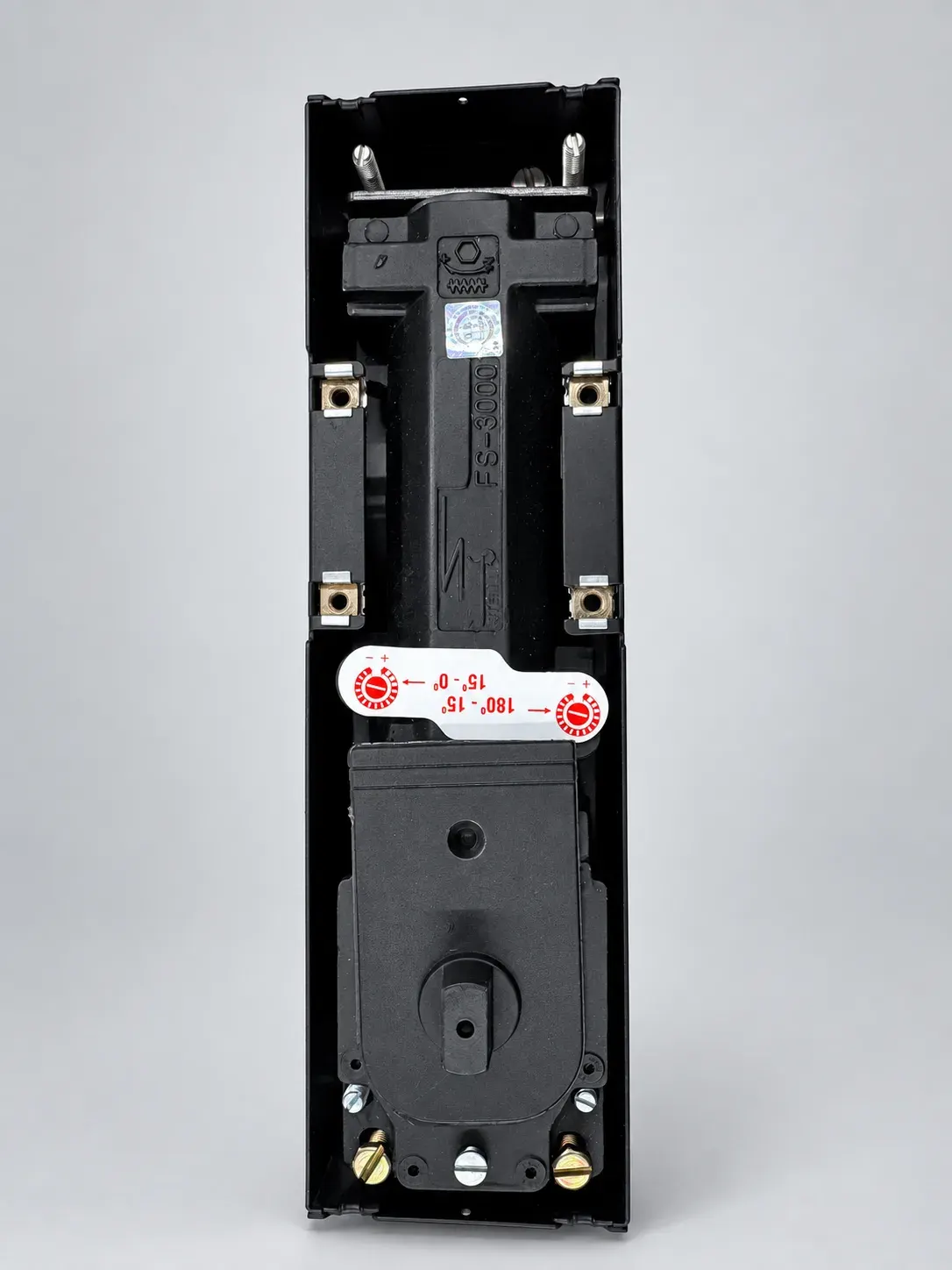 Sterling FS 3000 floor spring, cover plate removed, top view showing the FS-3000 casting and the valve adjustment sticker, studio photograph