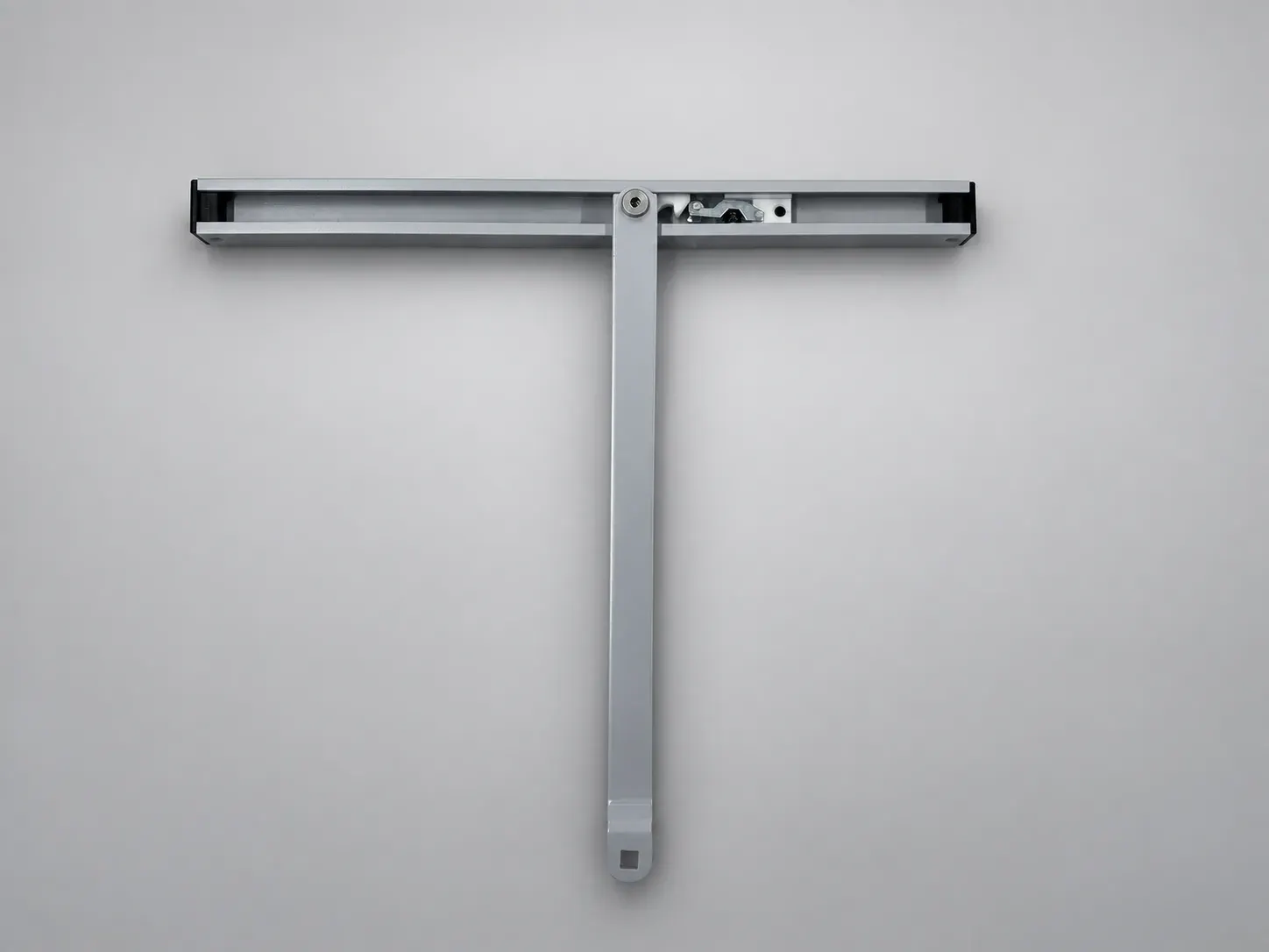 Slide track with its sliding arm held at a right angle and the hold-open catch visible inside the channel, front view, studio photograph