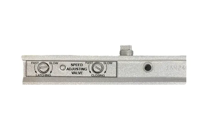 Front face of a Sterling closer showing the latching and closing speed adjusting valves